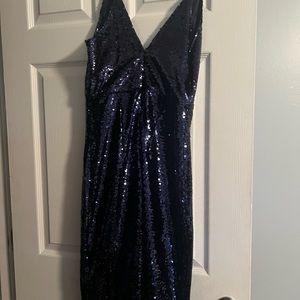 Royal blue sequin dress with small ruffle bottom. Worn once. Like new Bebe brand